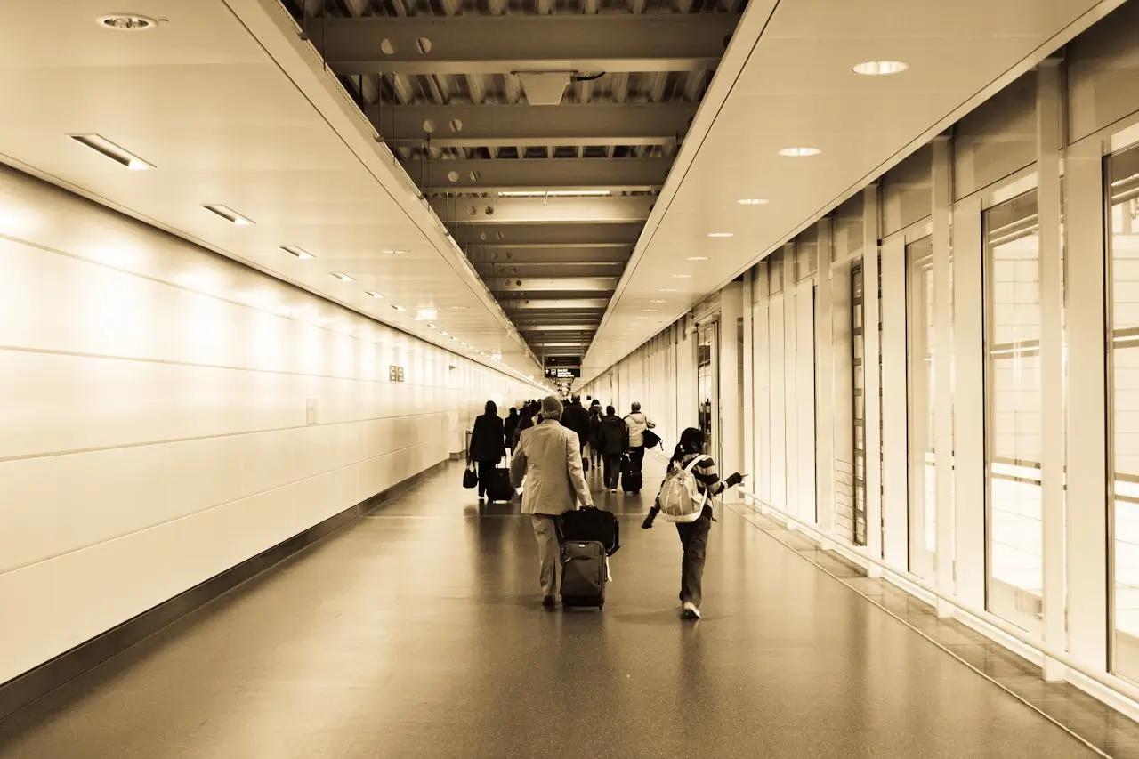 People Walking in the Airport Terminal Hallway Business Travel Services Travel On Call Photo by Download a pic on Pexels | Travel On Call
